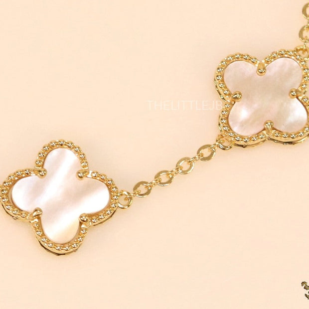 Gold plated chain bracelet with mother of pearl clover
