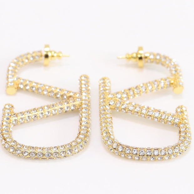 Open golden alphabet V earrings with cz 62 mm
