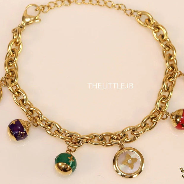 Gold plated link chain bracelet with multi enamel and MOP charms