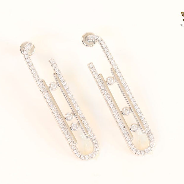 Platinum  sleek Cz earrings with 3 stones