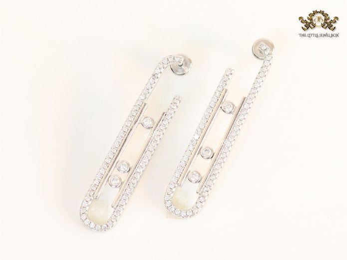 Platinum  sleek Cz earrings with 3 stones