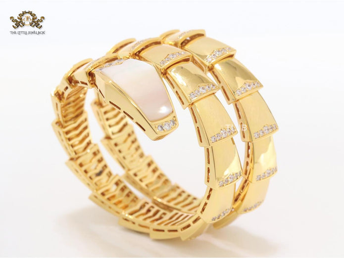 Bold gold and cz snake bracelet with white mop head