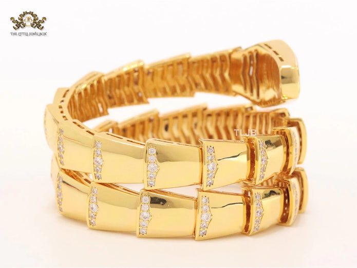 Bold gold and cz snake bracelet with white mop head