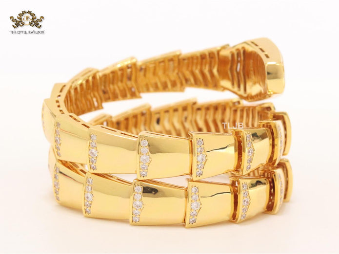 Bold gold and cz snake bracelet with white mop head