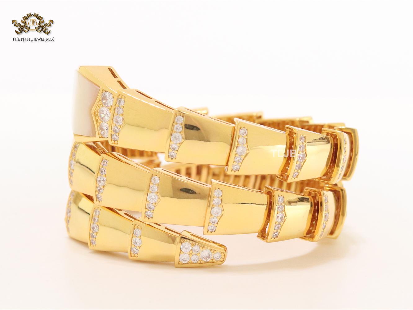 Bold gold and cz snake bracelet with white mop head