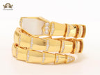 Bold gold and cz snake bracelet with white mop head