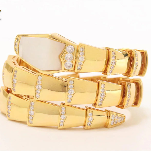 Bold gold and cz snake bracelet with white mop head