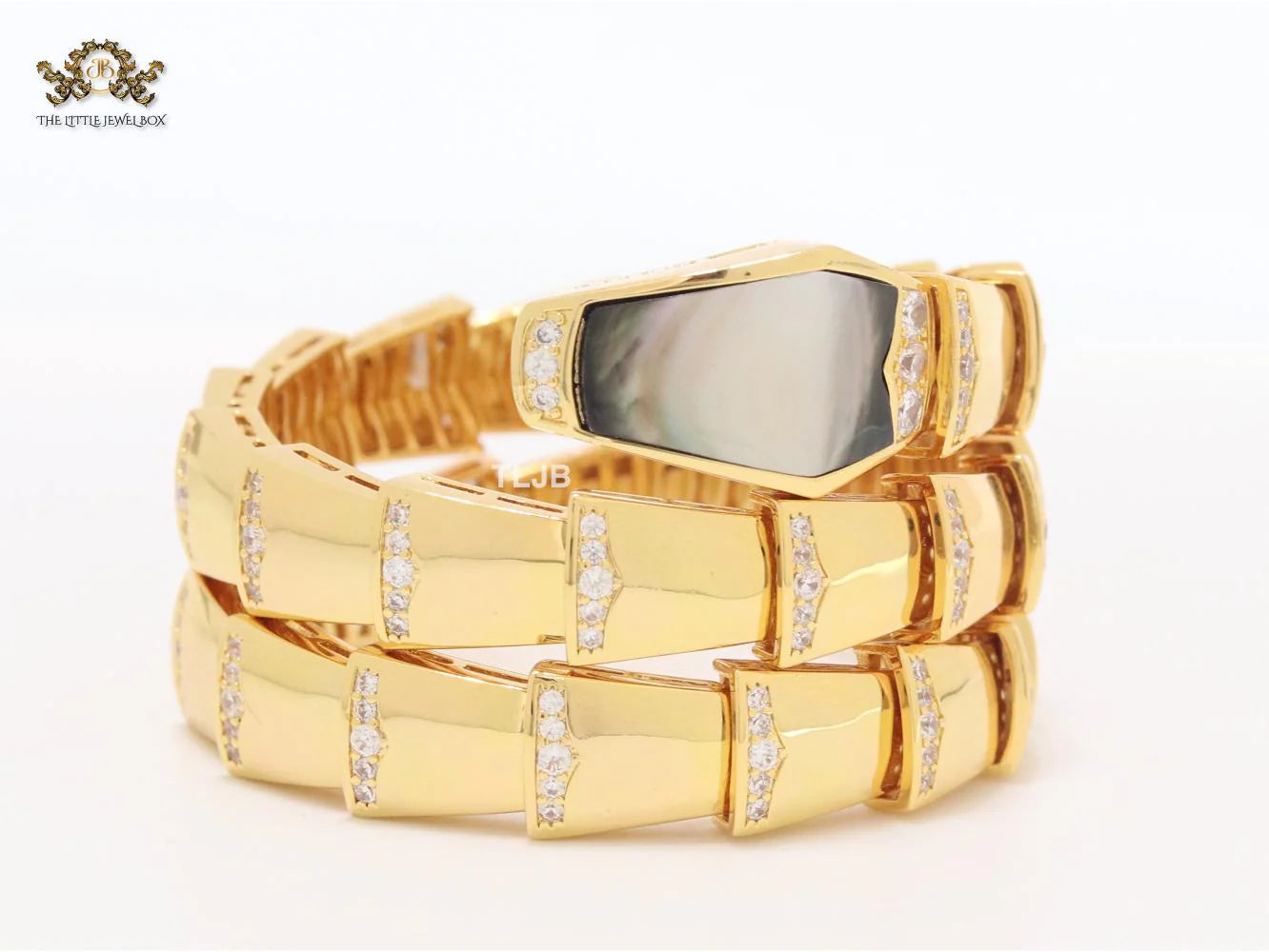 Bold gold and cz serpenti bracelet with black mop head