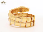 Bold gold and cz serpenti bracelet with black mop head