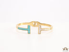 Gold plated open bracelet with blue enamel and MOP ends