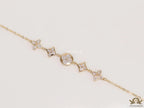 Gold plated chain bracelet with cz clovers and flowers