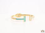 Gold plated open bracelet with blue enamel and MOP ends