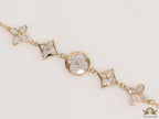 Gold plated chain bracelet with cz clovers and flowers