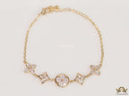 Gold plated chain bracelet with cz clovers and flowers