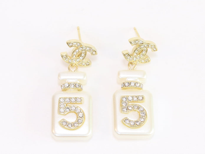 Double C gold danglers with 5 in CZ on white enamel