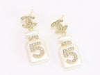 Double C gold danglers with 5 in CZ on white enamel