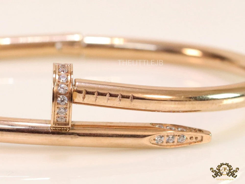 Rose gold plated nail bracelet with cz