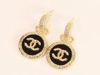 Double C on black enamel hanging gold earrings with CZ