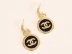 Double C on black enamel hanging gold earrings with CZ