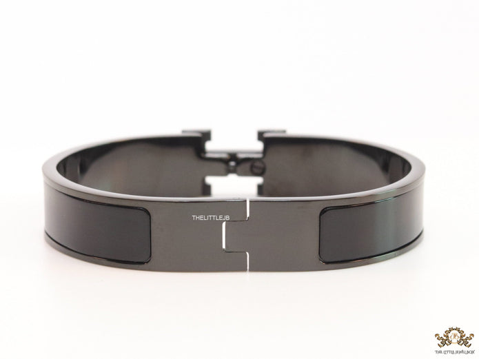 Broad black bracelet with H alphabet in centre