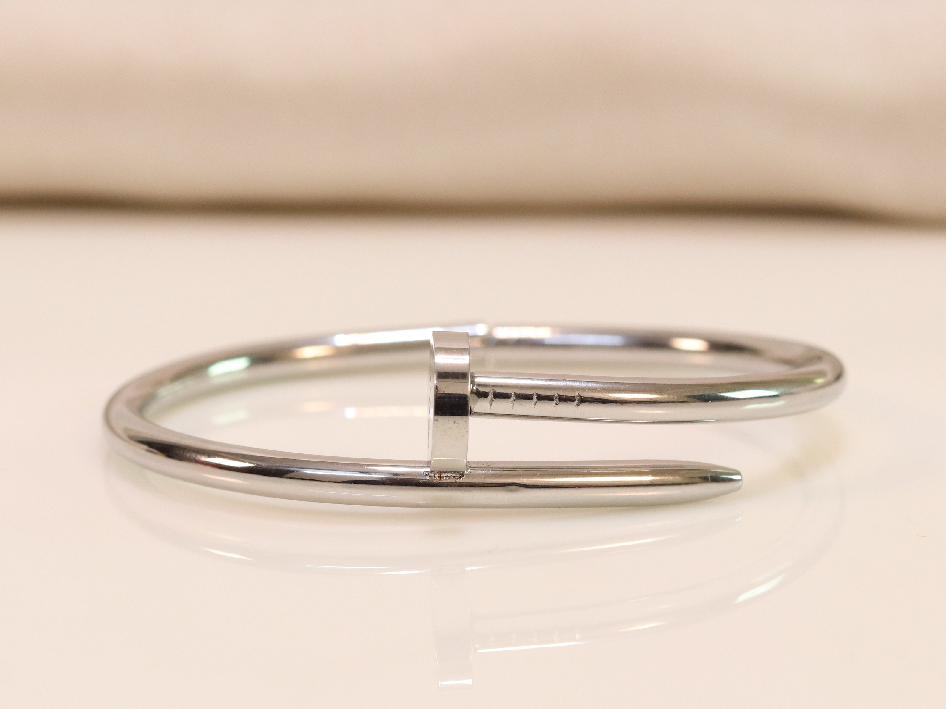 platinum plated nail bracelet with cz