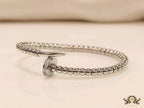 Platinum plated cz and metallic bead nail bracelet-openable