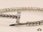 Platinum plated cz and metallic bead nail bracelet-openable