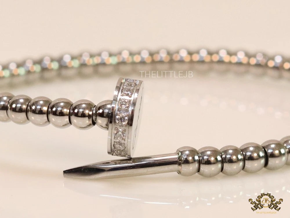 Platinum plated cz and metallic bead nail bracelet-openable