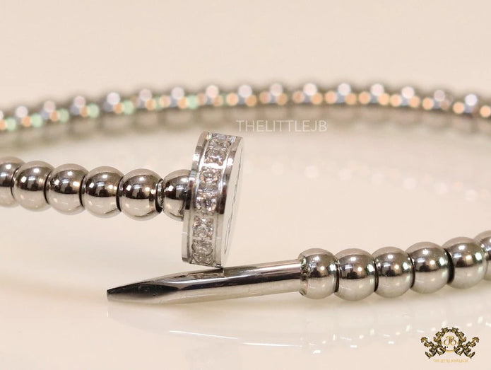 Platinum plated cz and metallic bead nail bracelet-openable