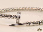 Platinum plated cz and metallic bead nail bracelet-openable