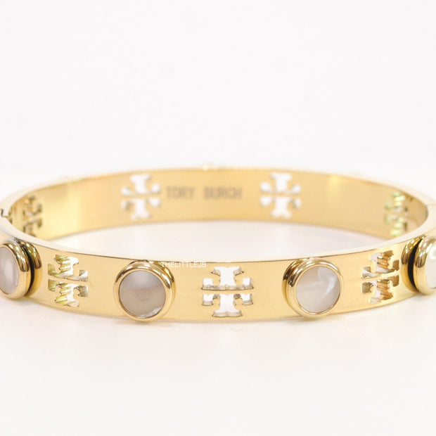 Gold plated cutwork twin T motif bracelet with white stones