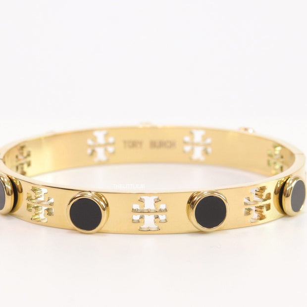 Gold plated cutwork twin T motif bracelet with black stones