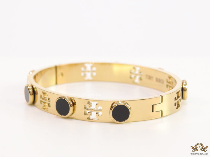 Gold plated cutwork twin T motif bracelet with black stones