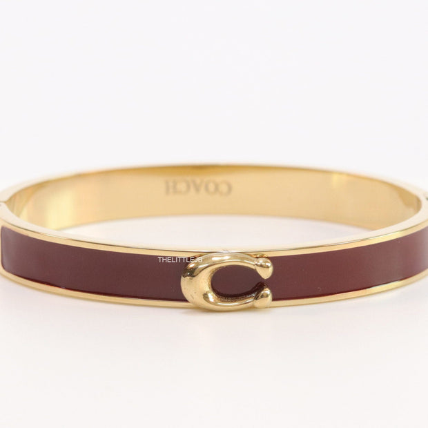 Sleek maroon and golden bracelet with C alphabet in centre