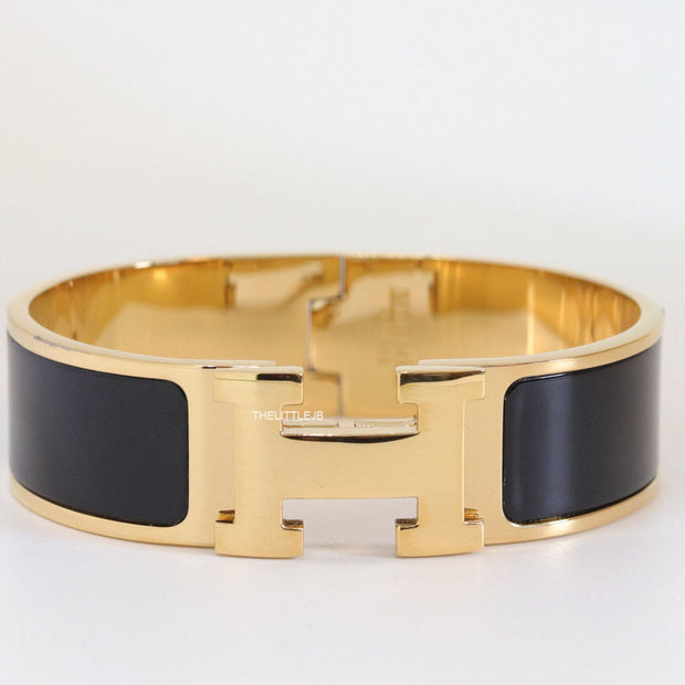 Openable H motif 18mm black bracelet in a shiny gold plating