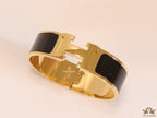 Openable H motif 18mm black bracelet in a shiny gold plating