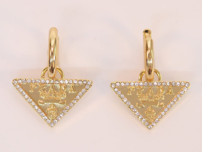 Gold Dangling Triangle earrings on small hoops with CZ