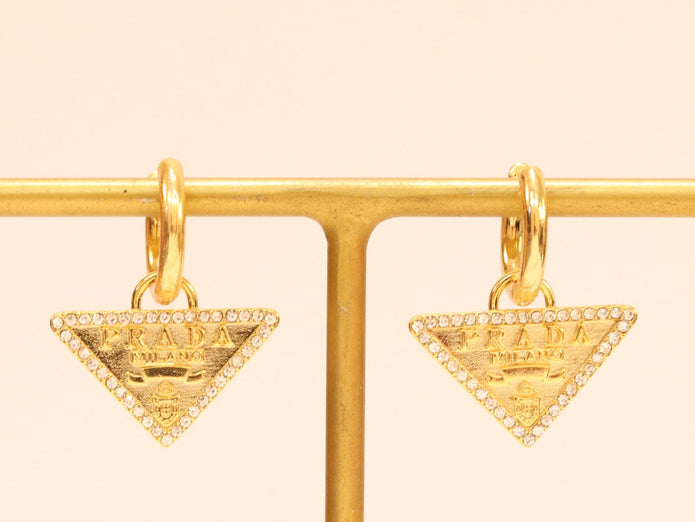 Gold Dangling Triangle earrings on small hoops with CZ