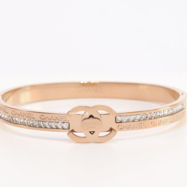 Rose gold plated bracelet with cz, inscribed alphabets and twin disc motif
