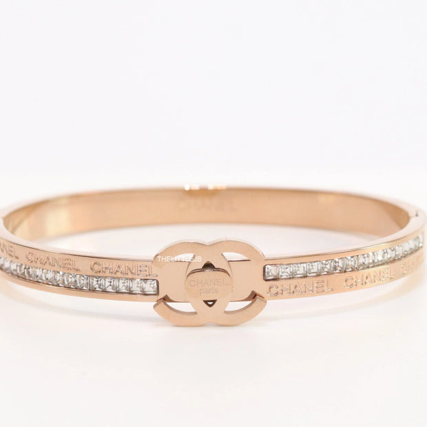 Rose gold plated bracelet with cz, inscribed alphabets and twin disc motif