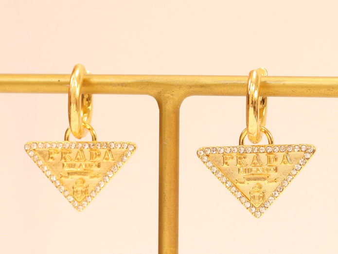 Gold Dangling Triangle earrings on small hoops with CZ