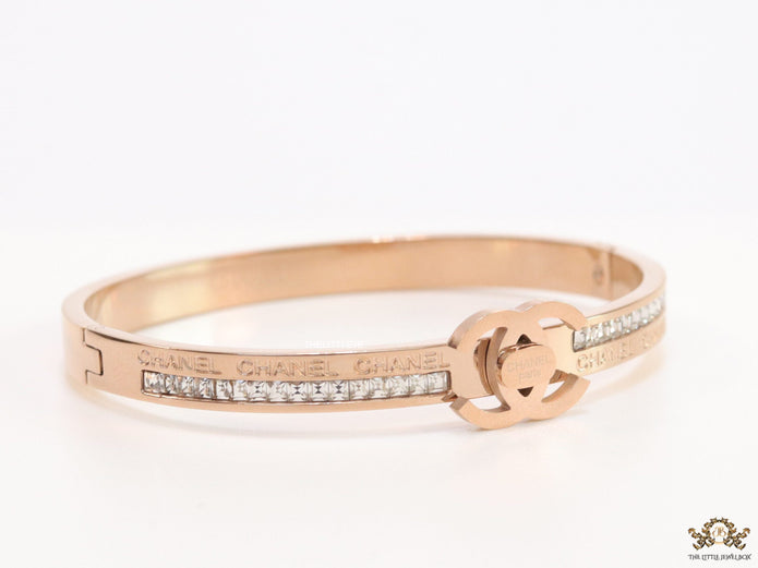 Rose gold plated bracelet with cz, inscribed alphabets and twin disc motif