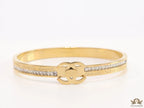 Gold plated bracelet with cz, inscribed alphabets and twin disc motif