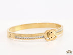Gold plated bracelet with cz, inscribed alphabets and twin disc motif