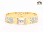 Alphabet H baby pink and blue motifs on white bracelet