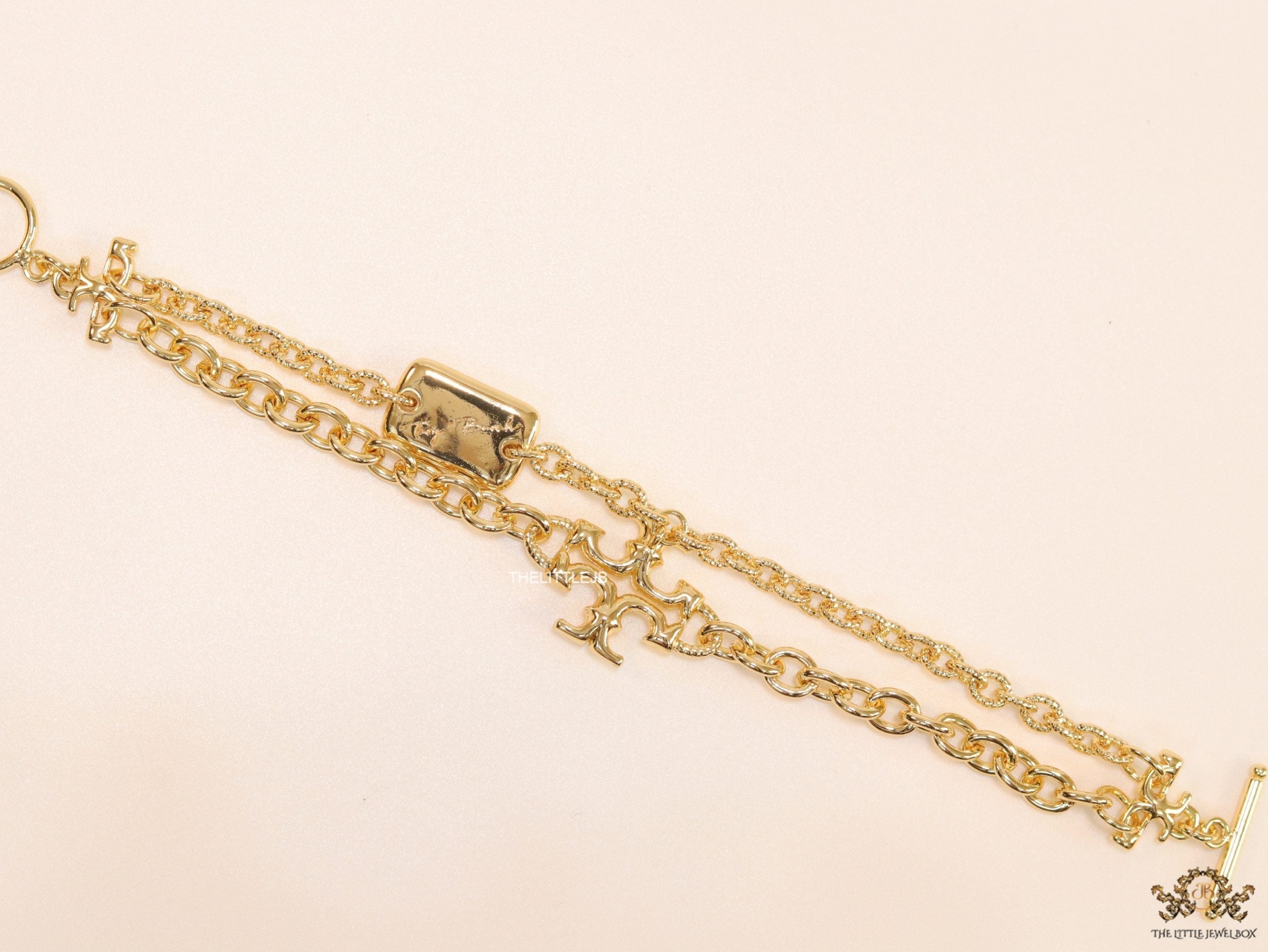 Gold plated two layered link chain bracelet with T motif