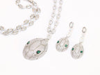 Platinum Snake head pendant set with emerald detailing