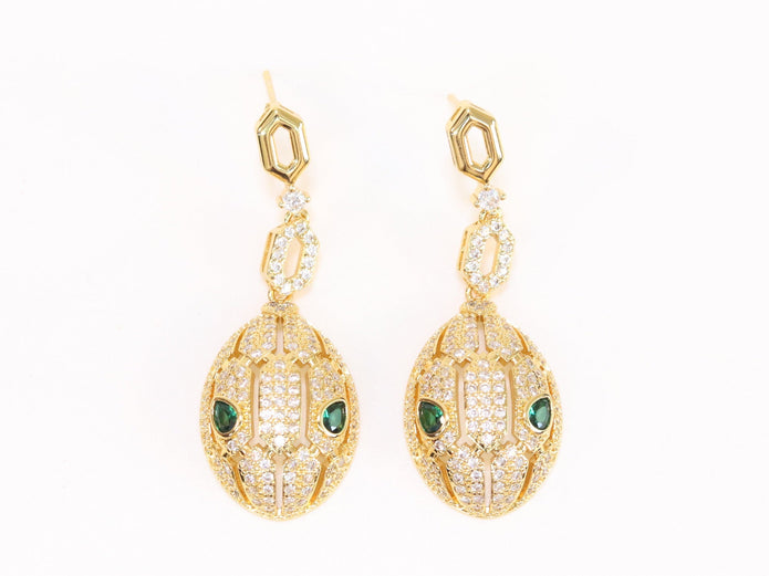 Gold Snake head pendant set with emerald detailing