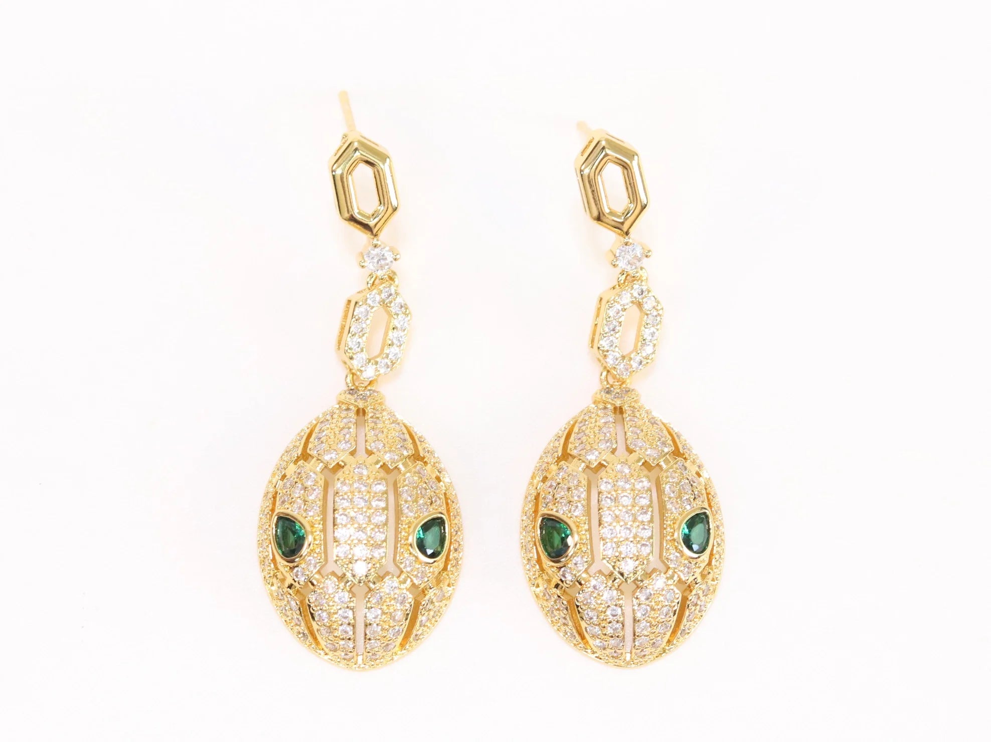 Gold Snake head pendant set with emerald detailing