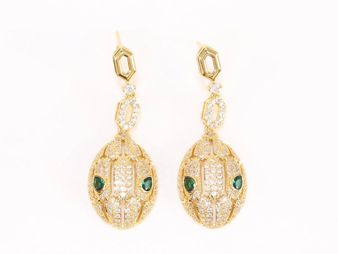 Gold Snake head pendant set with emerald detailing